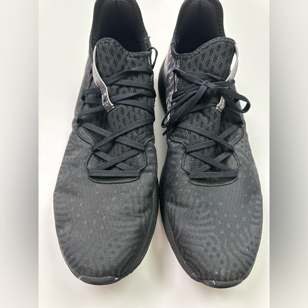 New Balance Fuelcell V100 Black Sneakers with camo accents.